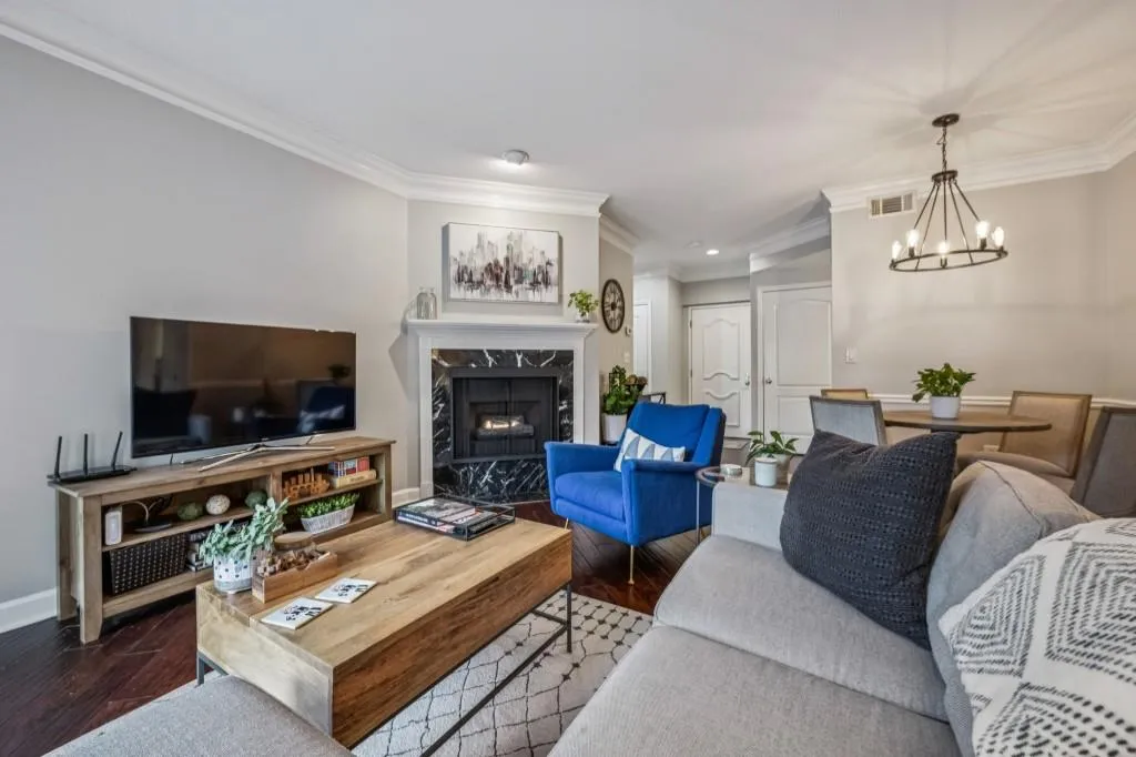 The Fireside Living Room with a striking Black Stone Surround sets the tone for relaxed sophistication.
