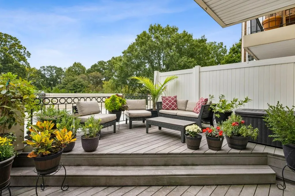Private Outdoor Terrace Oasis   an expansive two-tiered retreat with a partially covered section perfect for Al Fresco Dining and entertaining year-round.