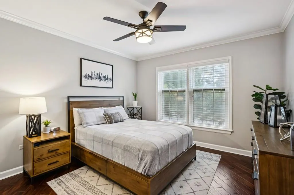 A Primary Ensuite offers a Double Stone Vanity, Glass Shower, and Walk-In Closet, while the Secondary Bedroom boasts direct terrace access, its own Walk-In Closet, and a nearby Full Bath.
