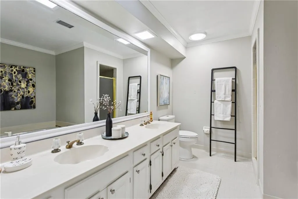 Second primary bathroom with double vanity, soaking tub and separate shower