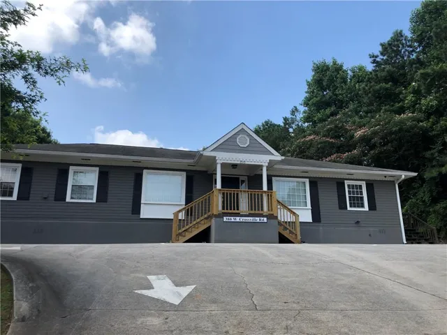 Gray siding exterior with white trim and black shutters