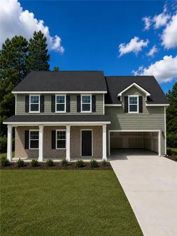 Two-story residence featuring a brick and siding facade, covered front porch with white columns, attached garage, and a concrete driveway