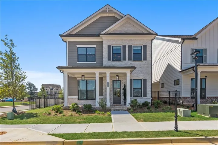 Kincaid Floor Plan Now Offered in Waterhaven in Cumming by The Providence Group - Picture of a previously built home, not the actual home.