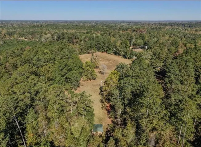 Expansive wooded landscape with clearings