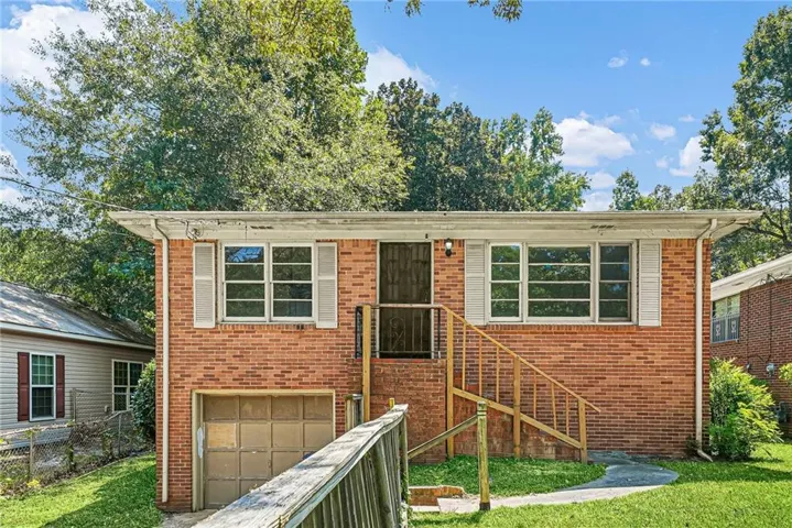 Brick exterior with white window shutters