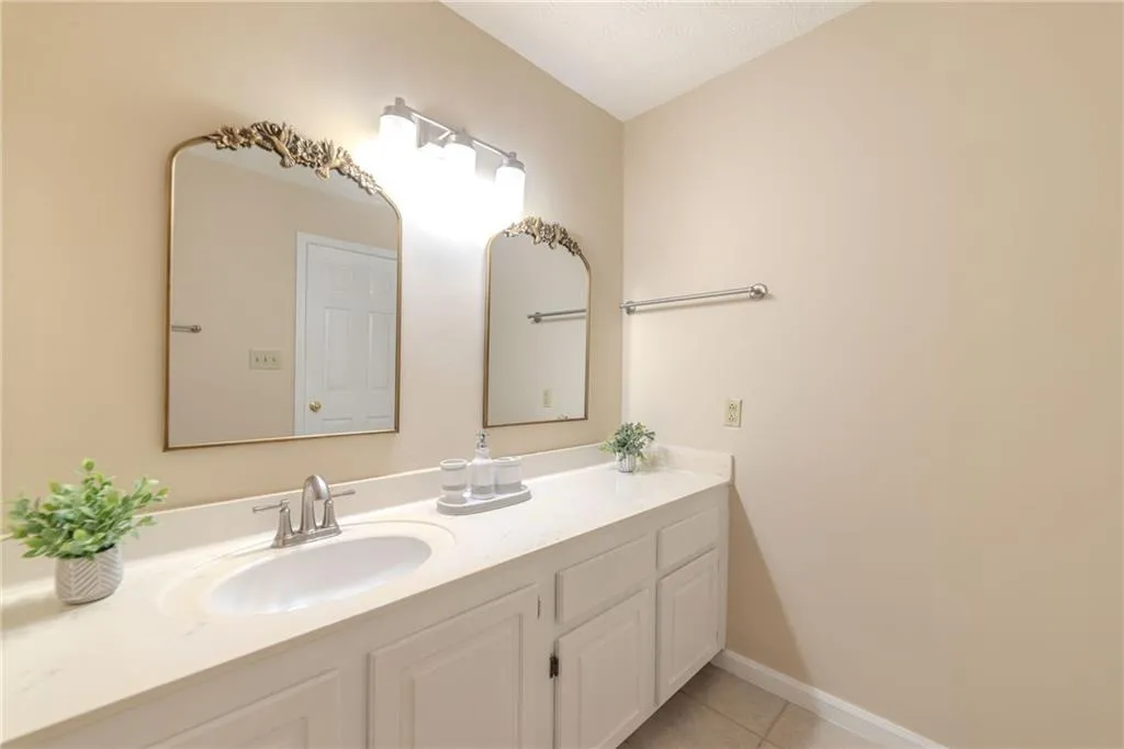 Bathroom featuring vanity and tile patterned floors