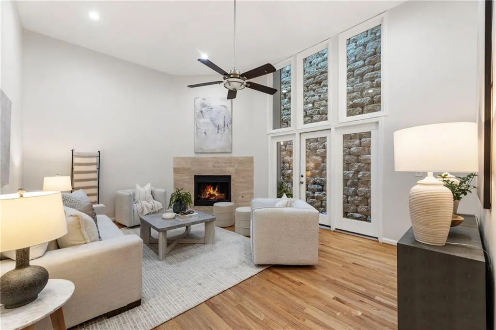 Two-story living room with cozy, gas-burning fireplace.