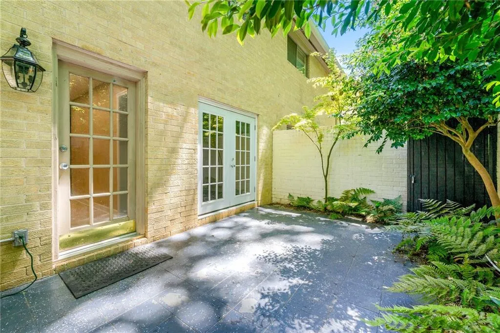 View of patio / terrace featuring french doors and fence