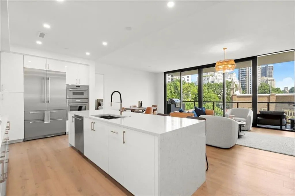 Designer chef's kitchen with upgraded tile and sleek modern finishes. Designer chef's kitchen with upgraded tile and sleek modern finishes.