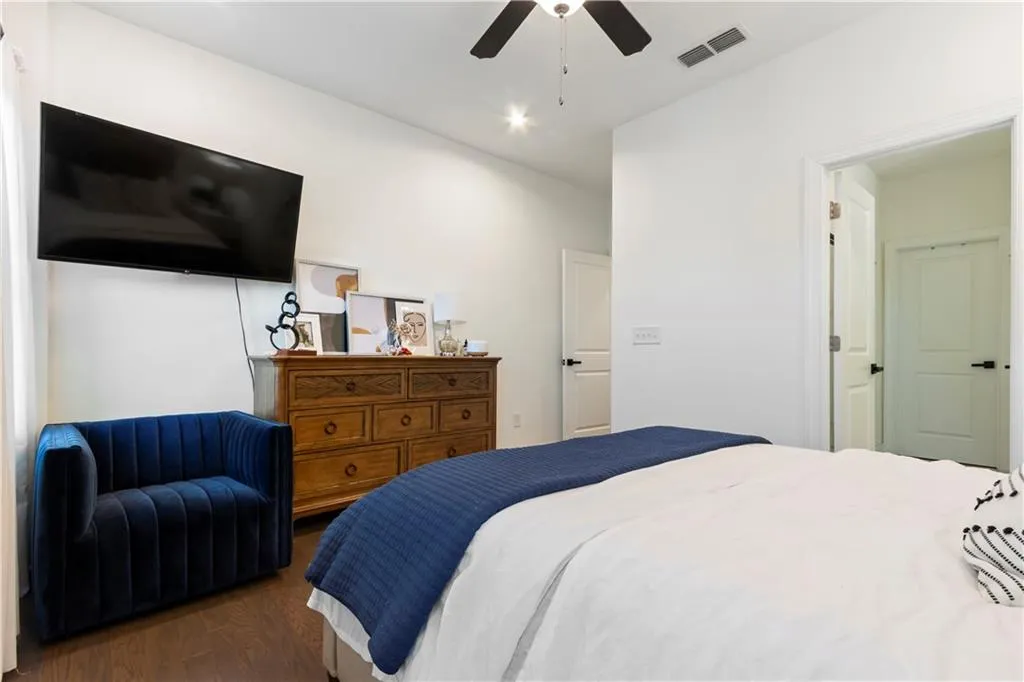 Bedroom featuring wood finished floors and a ceiling fan