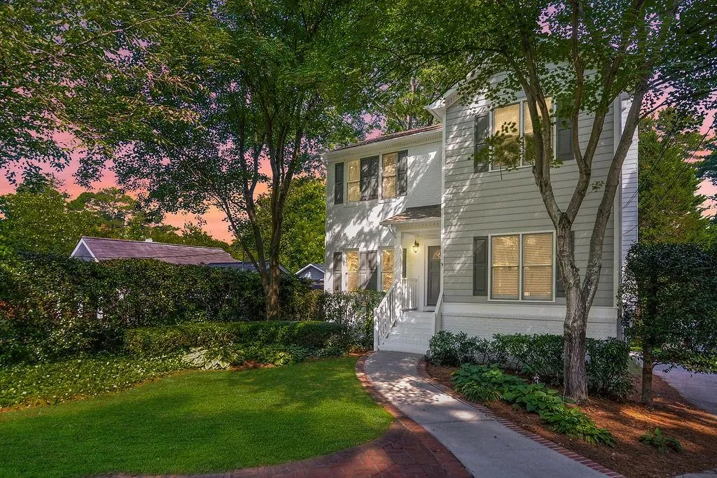 Traditional-style home with brick siding and a front yard