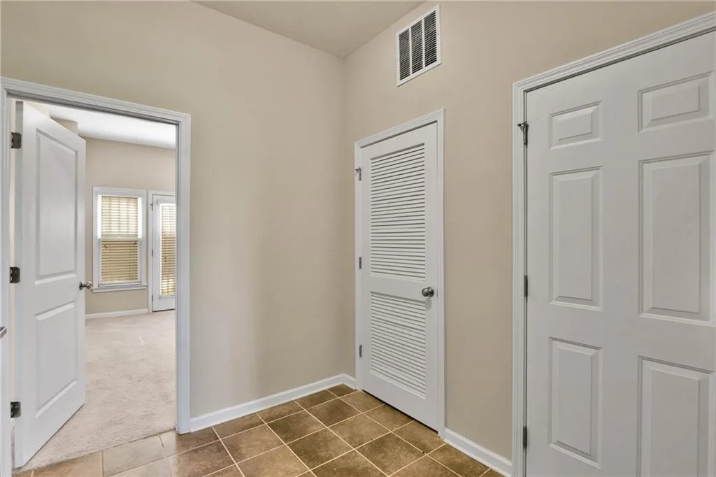 Downstairs Entryway leading to 3rd Bedroom and Full Bath