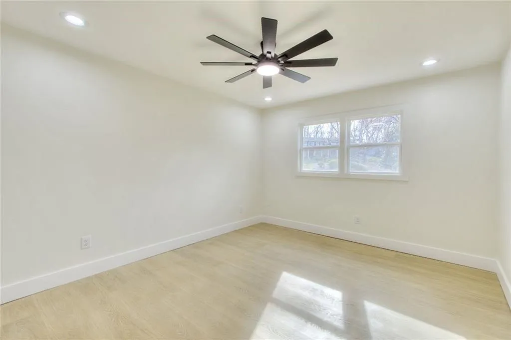 Unfurnished room featuring light wood-type flooring and recessed lighting