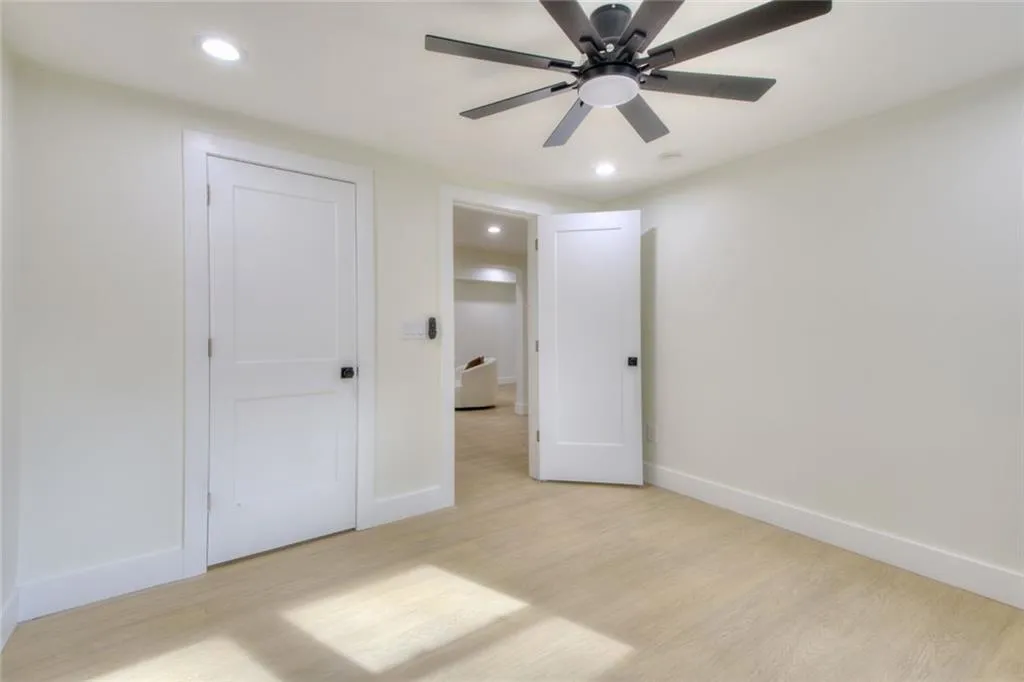 Unfurnished bedroom with light wood-style flooring, recessed lighting, and ceiling fan