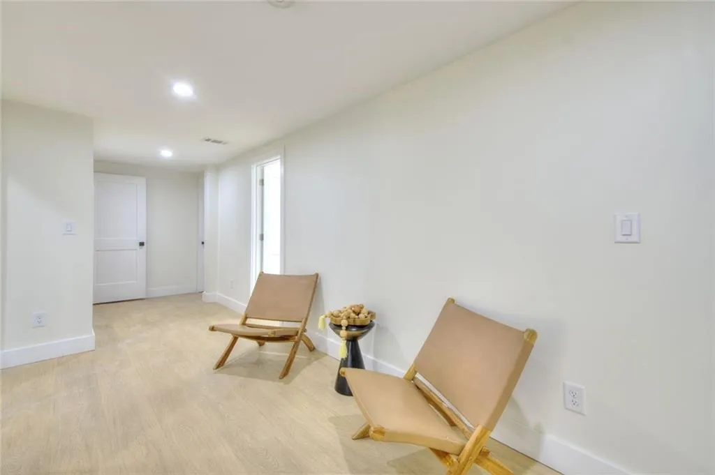 Sitting room featuring wood finished floors and recessed lighting