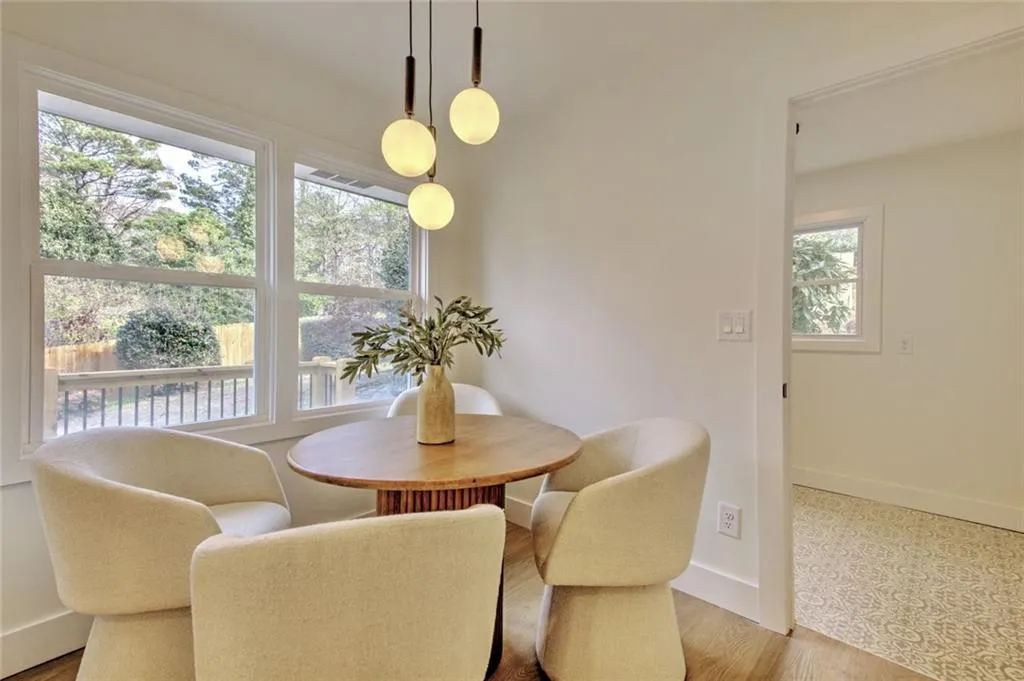Dining space with wood finished floors and baseboards