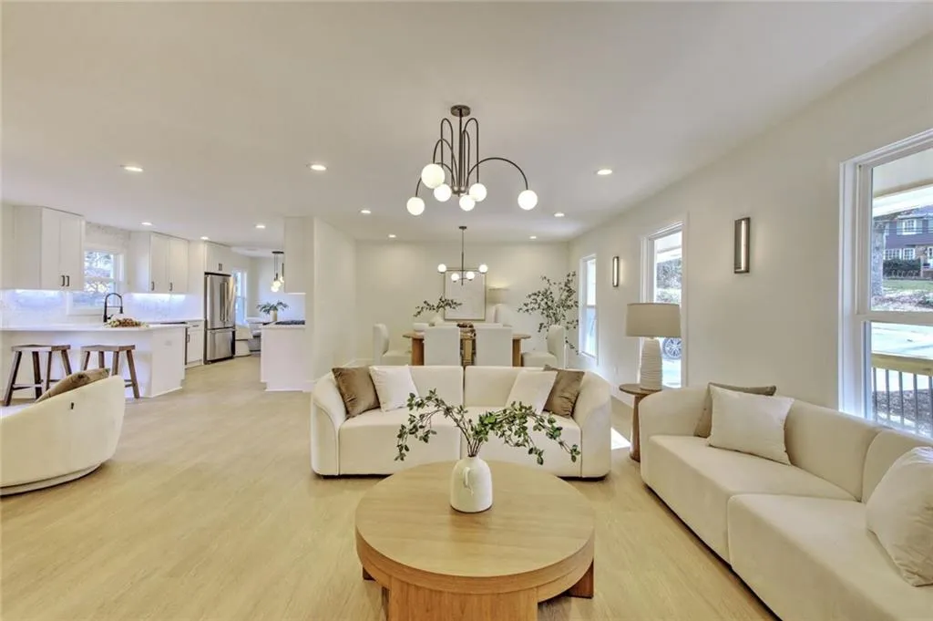 Living room featuring a chandelier and light wood-style flooring