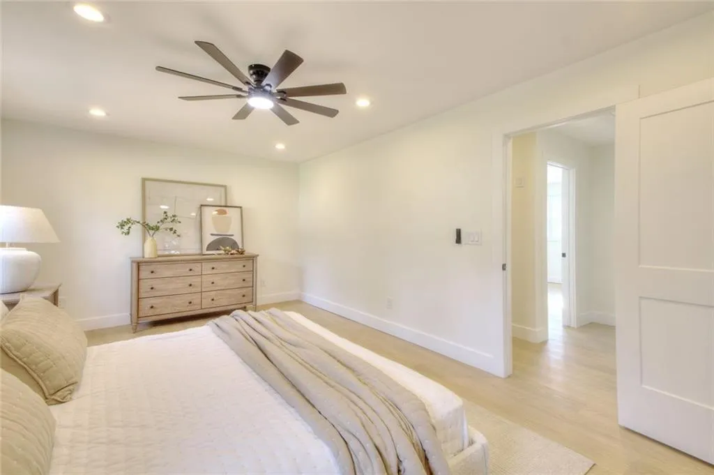 Bedroom with ceiling fan, light wood finished floors, and recessed lighting
