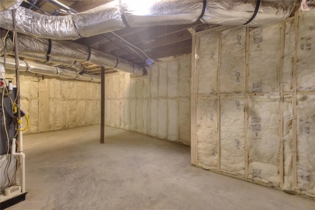 Unfinished basement with heating unit