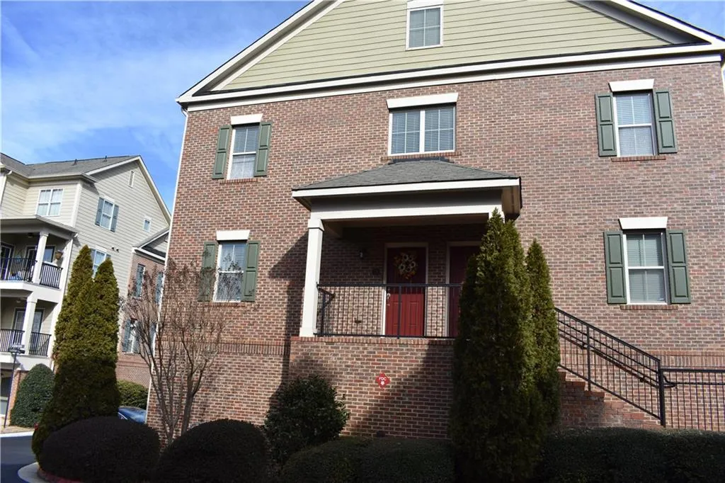 View of front of home featuring a balcony