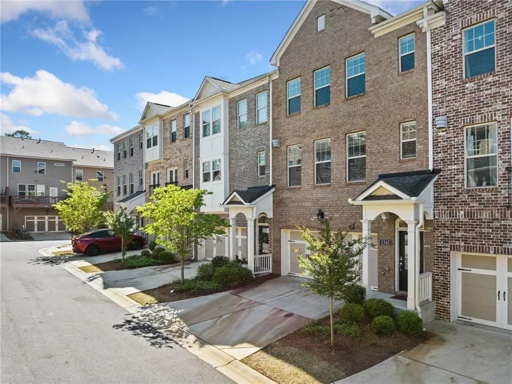 View of building exterior with a residential view and driveway