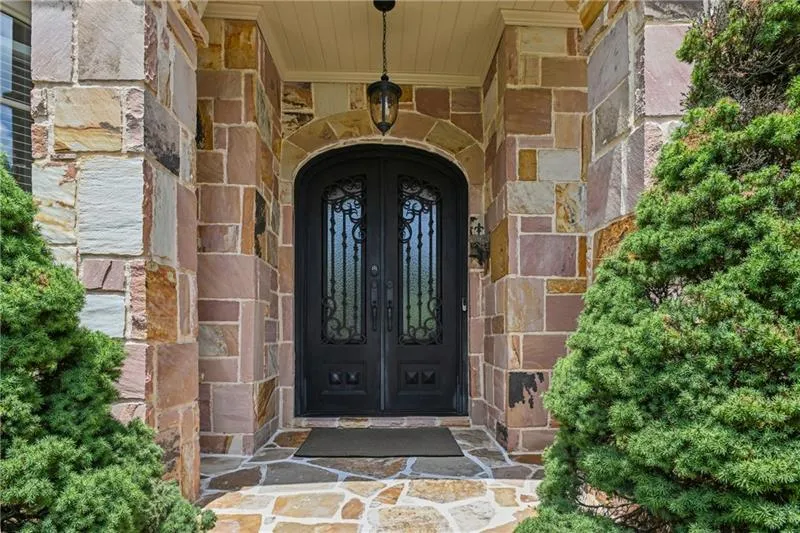 Custom wrought iron door with windows that open