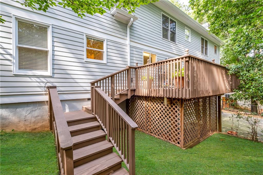 Wooden terrace with a lawn