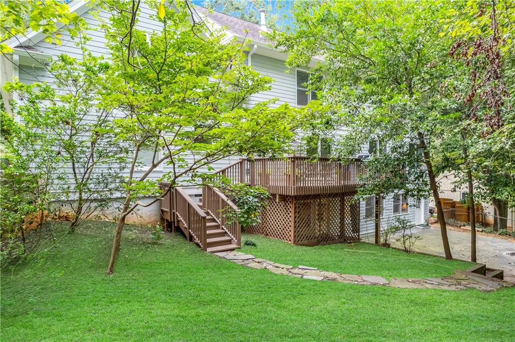 View of yard featuring a wooden deck