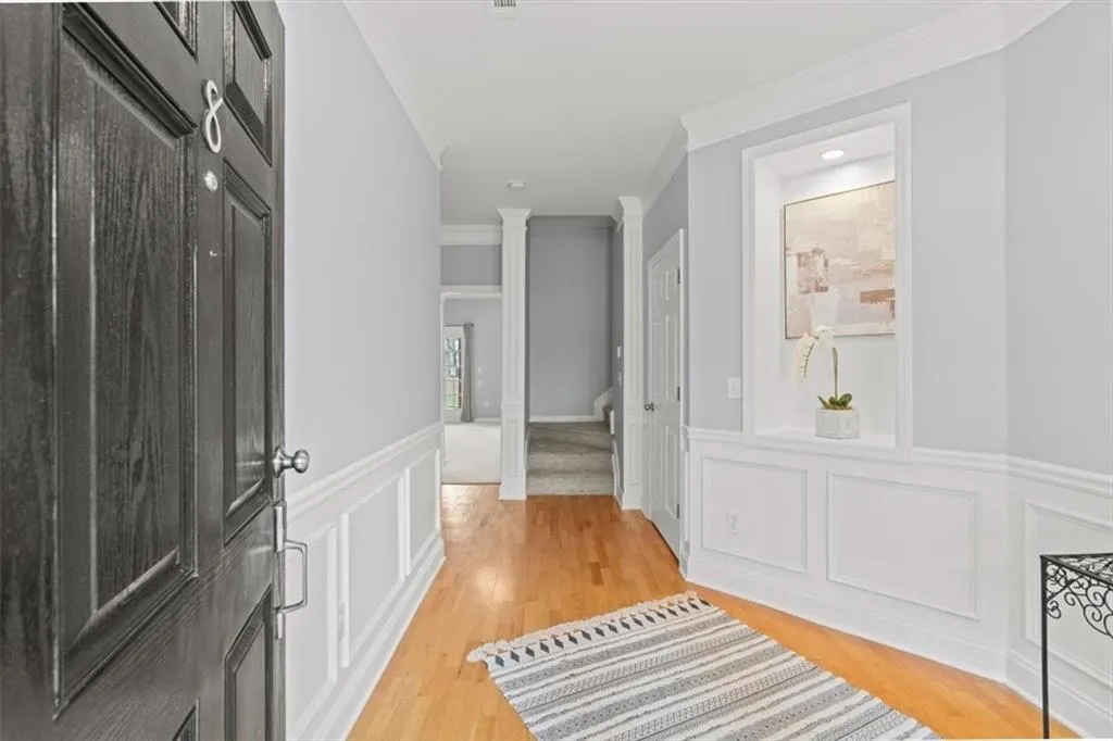 Sophisticated foyer features a wall niche to display your favorite art and accent piece.