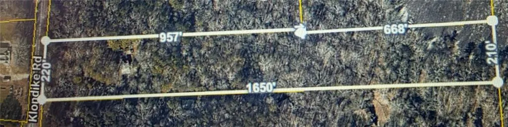 Survey Map. Illustrating the property boundaries and dimensions along Klondike Rd