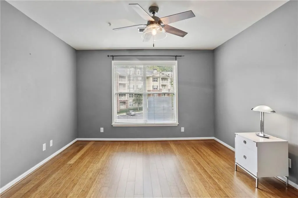 Unfurnished office or bedroom featuring light wood finished floors and a ceiling fan