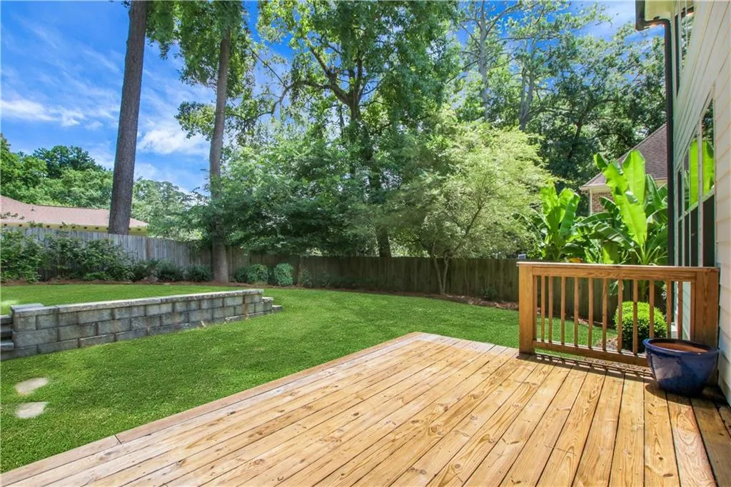 Walk right out of the breakfast area onto the deck and into a yard perfect for playing!