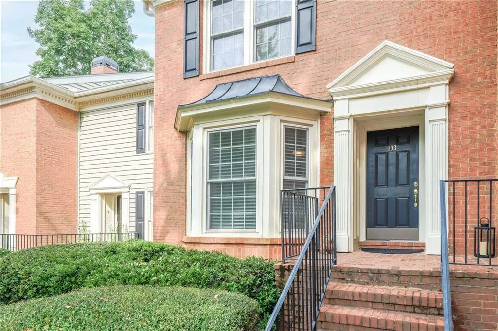 Entrance to property with brick siding