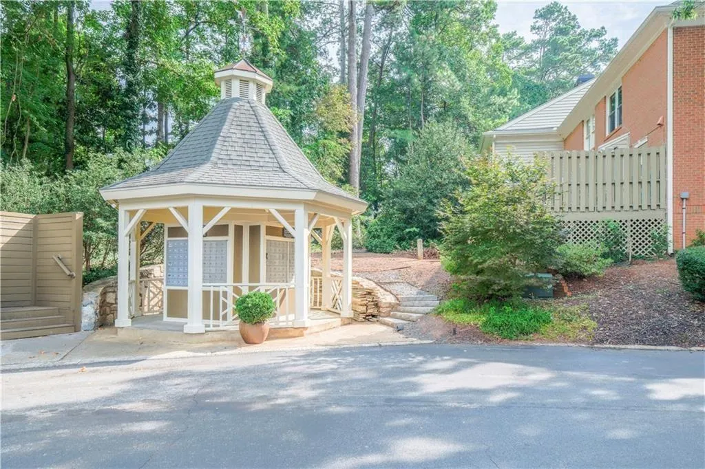 View of patio featuring a gazebo and view of scattered trees
