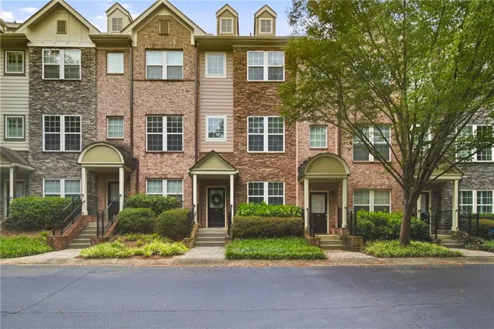 Brick and stone veneer exterior with gabled dormers