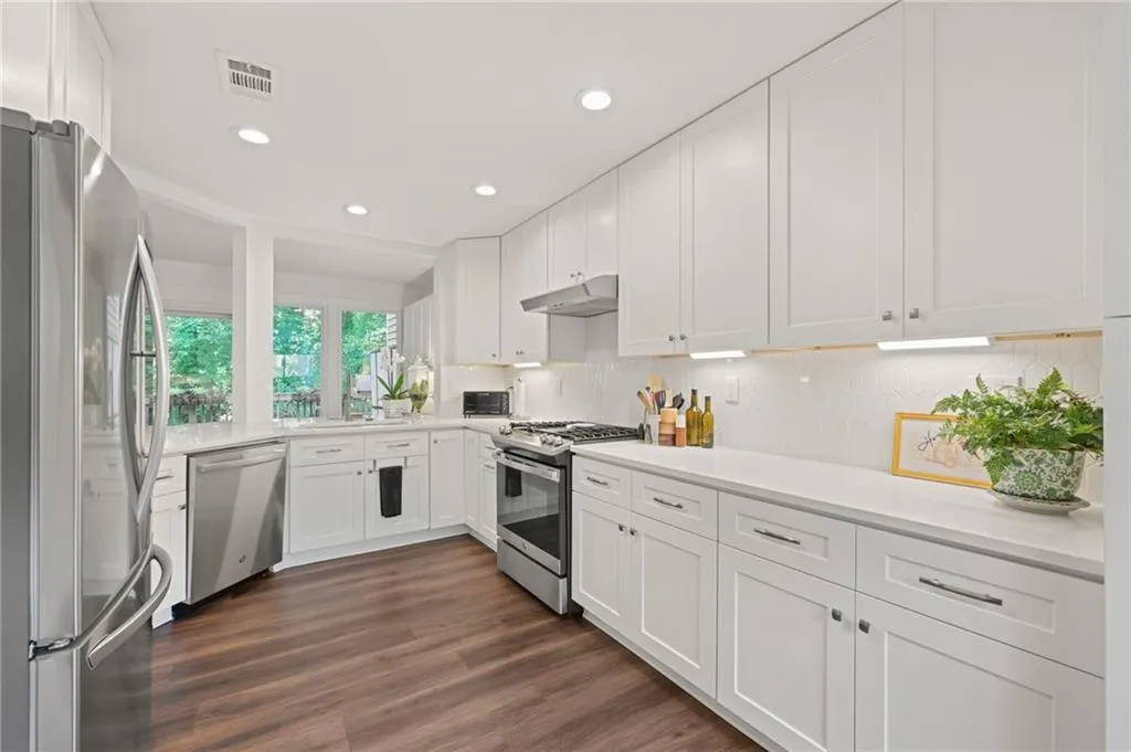 Crisp, white kitchen with quartz countertops