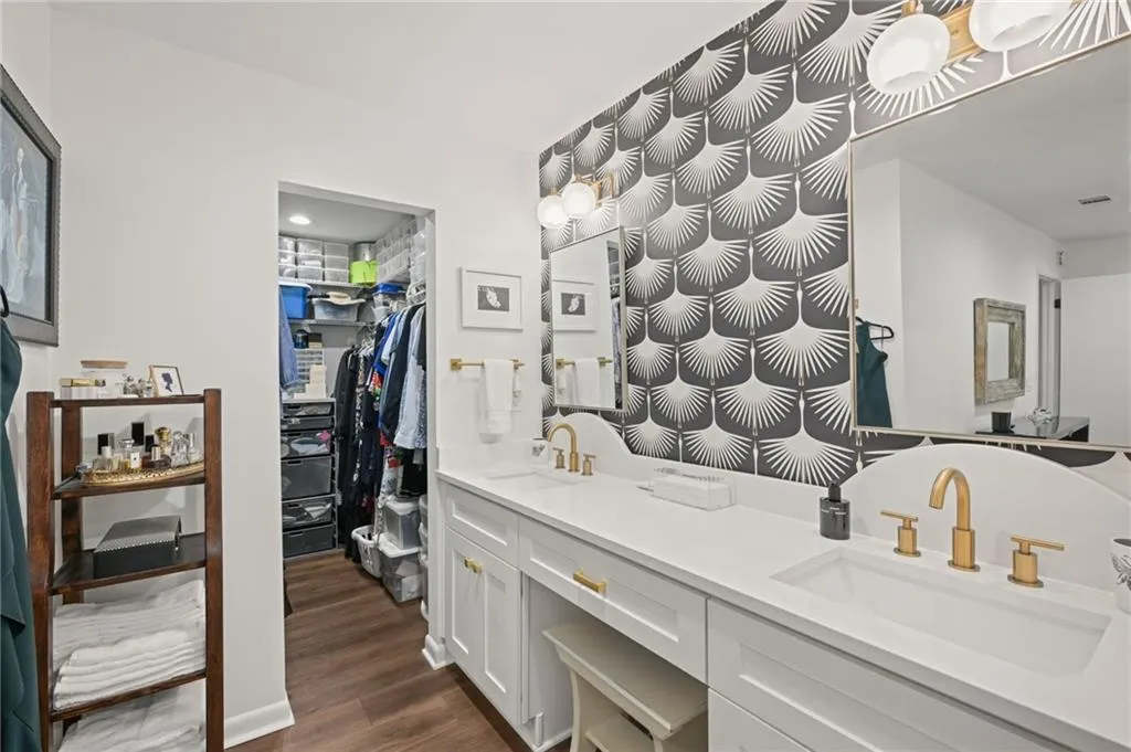 Built-in vanity seating with view of walk-in closet