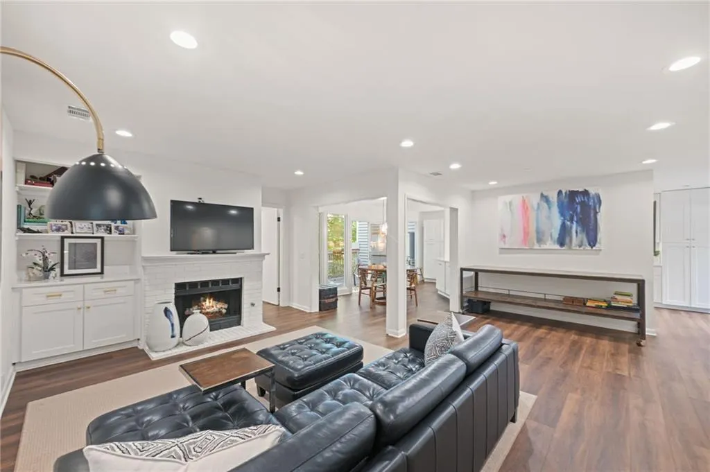 Open floorplan with a cozy fireplace and built ins