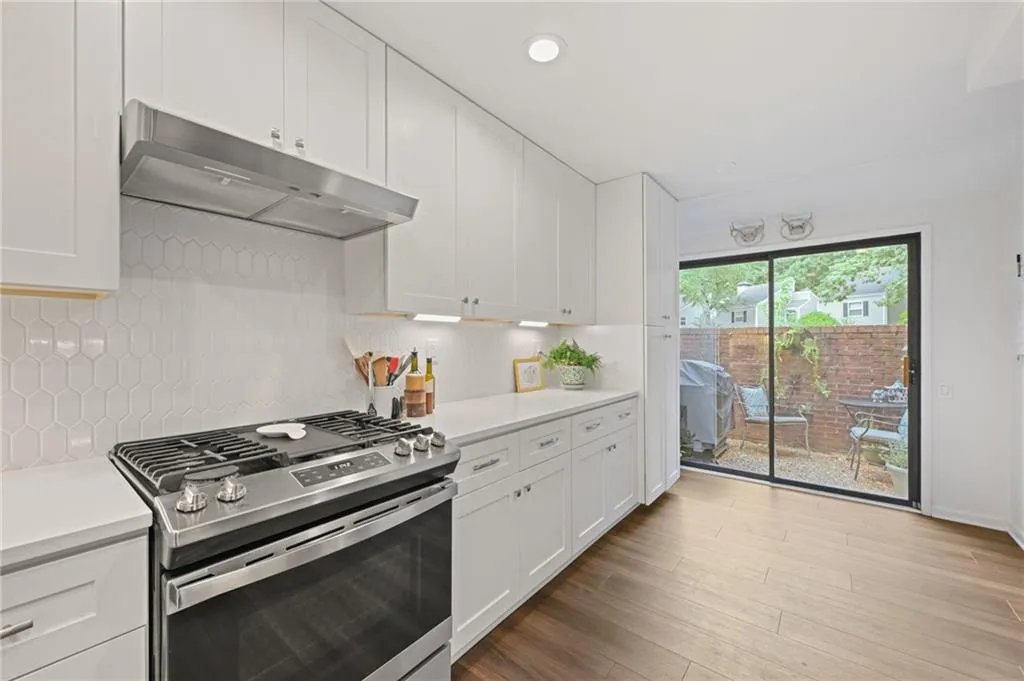 Sliding glass door leads to one of two outdoor areas