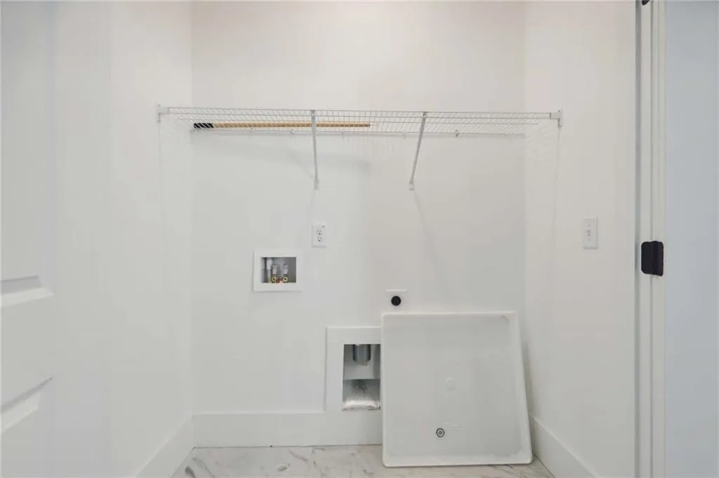 Laundry closet at the 2nd story off the loft. Photo example only.
