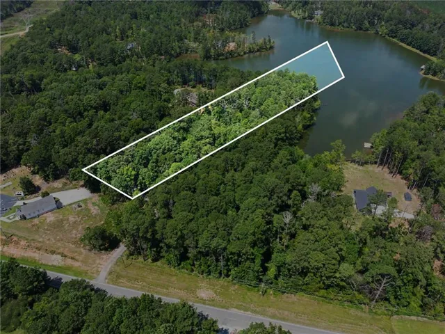 Wooded acreage with lake frontage