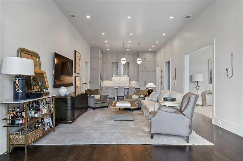Living area with wood finished floors and recessed lighting