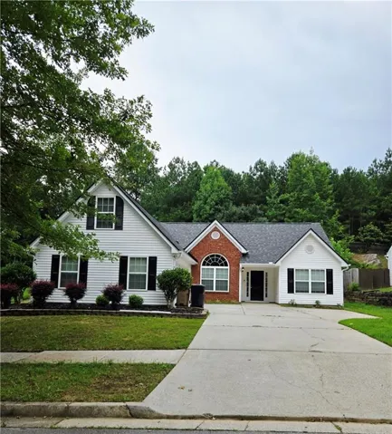 White siding exterior with black shutters