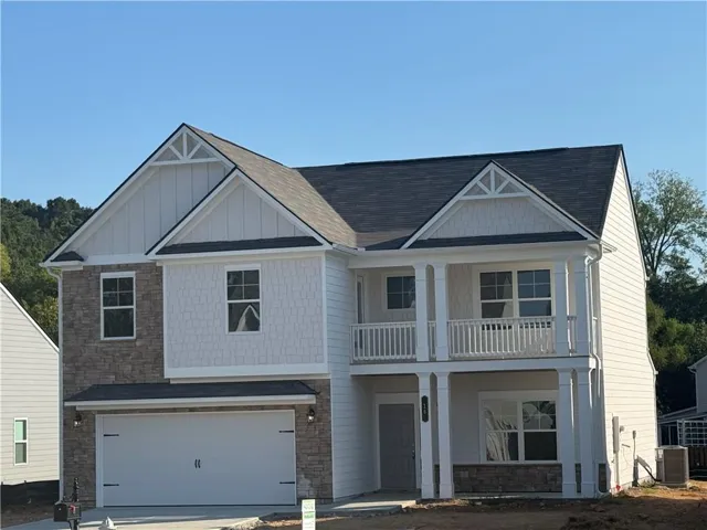 Two-story exterior with a covered porch and second-story balcony