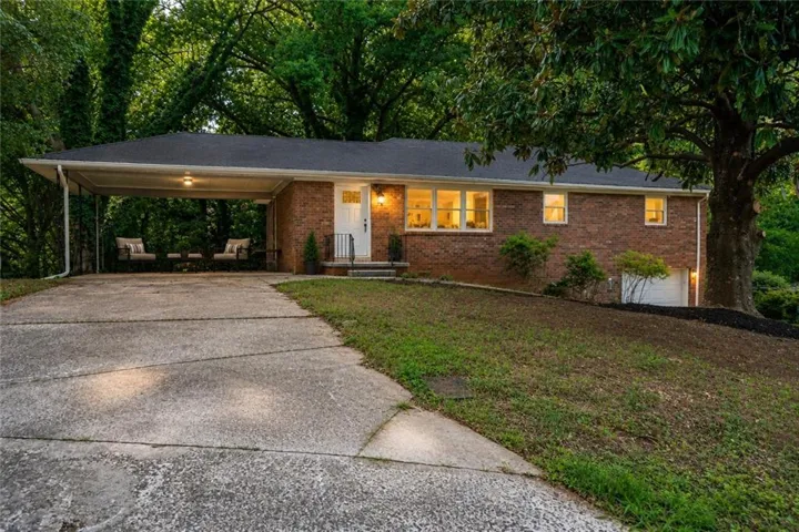 Brick exterior residence with a single-carport