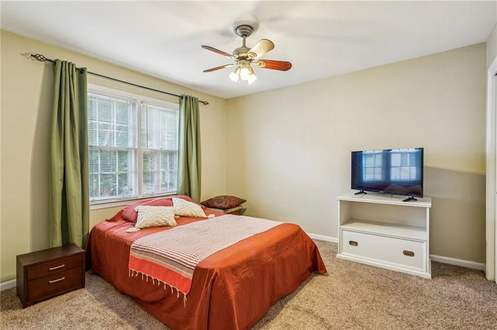 Bedroom featuring carpet floors and a ceiling fan