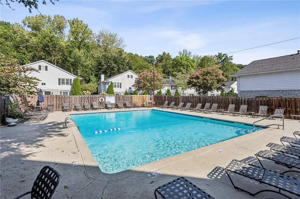 Community pool featuring a patio area