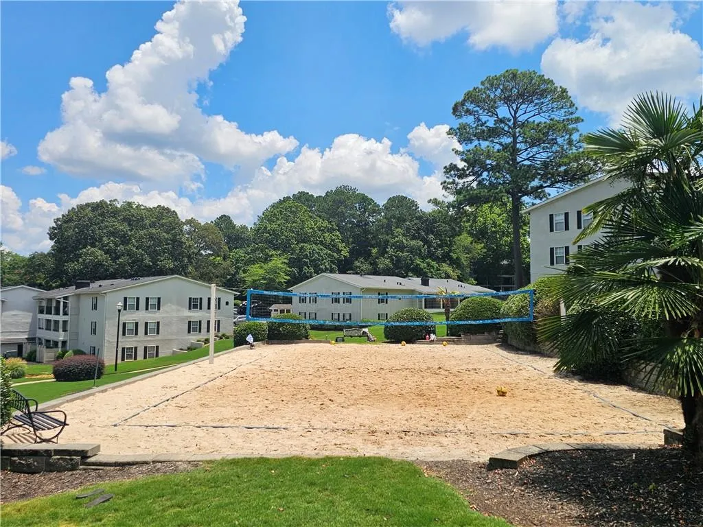 Surrounding community featuring volleyball court and a residential view