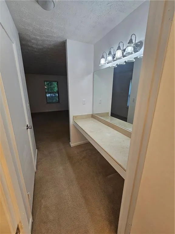 Bathroom with a textured ceiling