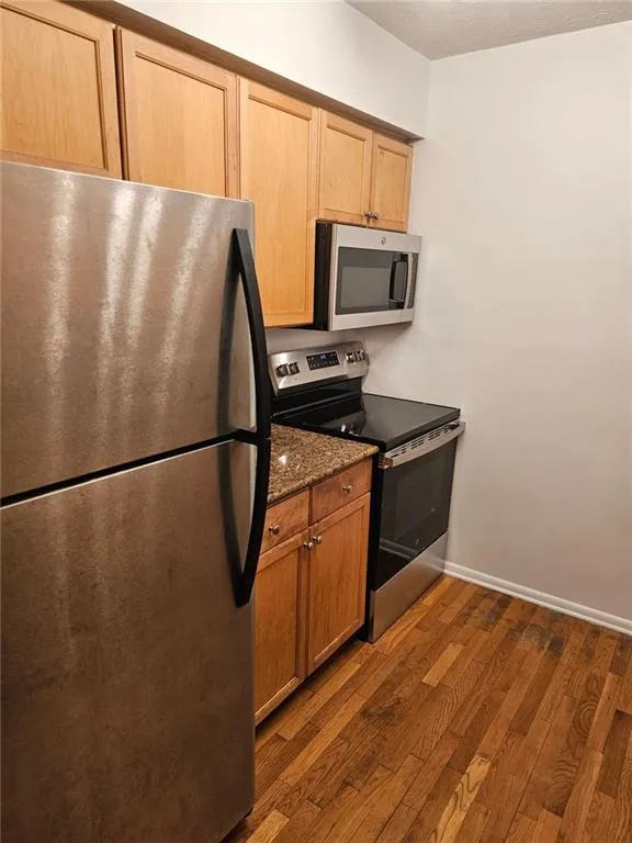 Kitchen has new stainless stove and microwave